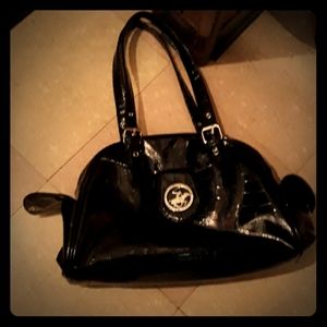 A black patent satchel